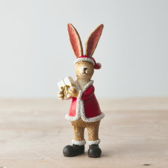 Standing Santa Rabbit With Present. A characterful standing bunny ornament wearing black boots, a Santa coat and hat holding a present