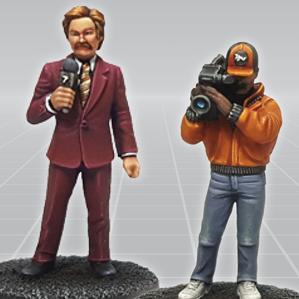 7TV News Team by Crooked Dice. A set of two white metal miniatures representing a TV presenter and cameraman making a great edition to your RPG, commentators for tabletop games and more hobby projects.