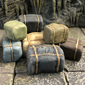 Trade Goods by Crooked Dice, a pack of 28mm scale resin miniatures representing trade bales for your RPG or tabletop game. 