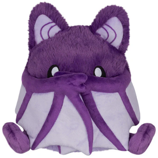 Purple plush bat toy held in a h...