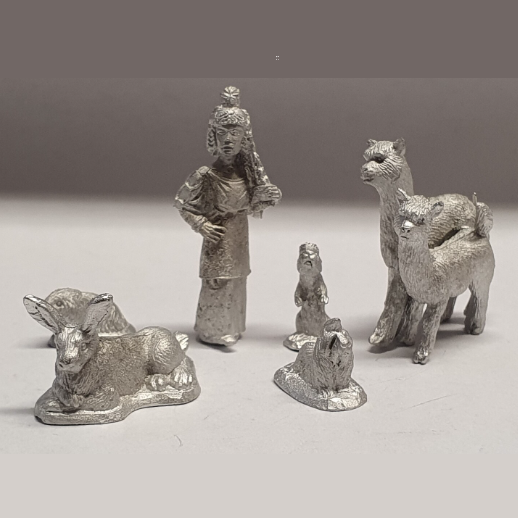 Bad Squiddo Games Alpaca Family. A set of four metal miniatures by Bad Squiddo Games for your RPGs, dioramas and other hobby needs. A set of four alpacas but two make a cuddling set.