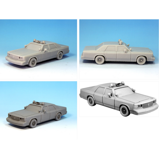 Model police car on a grey backg...