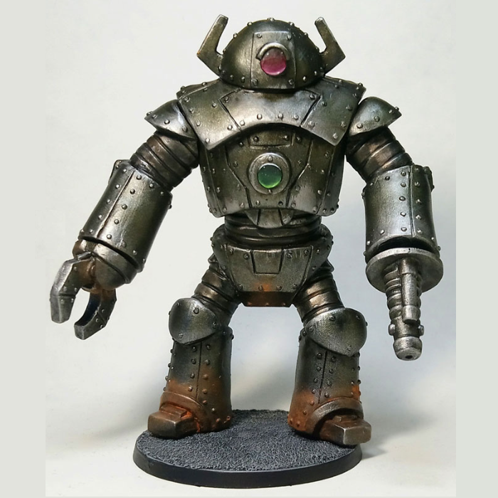 Giant Robot by Crooked Dice. A resin kit of a robot that requires assembly and is sculpted by Andrew May and comes with two hands, one claw and one death ray and stands approximately 90mm tall.