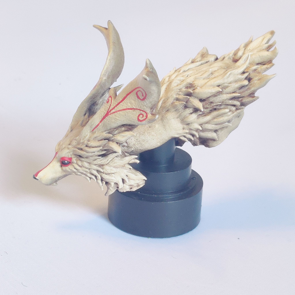 Fae Dragon Bust by Iron Gate Scenery. A 28mm scale printed resin miniature representing a fae dragon with a slender fox style face and wonderfully textured fur for your painting joy and hobby collection