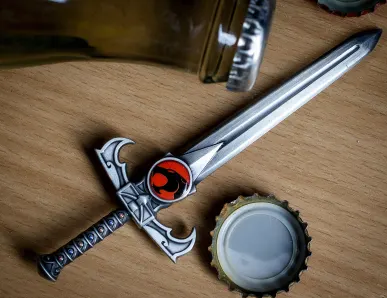 A miniature silver sword with a ...