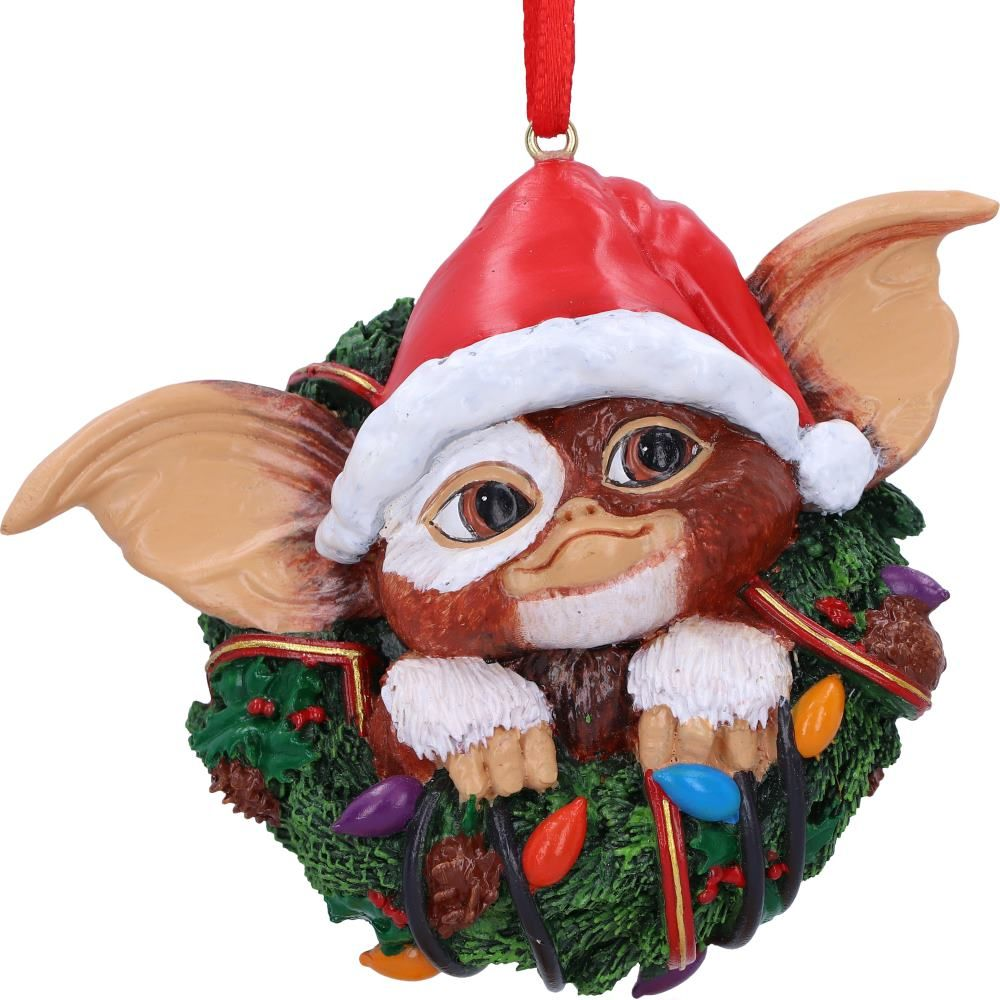 Gremlins Gizmo in Wreath Hanging Ornament. Gizmos head, ears and hands wearing a christmas hat poking through the middle of a green christmas wreath - Nemesis Now ornament