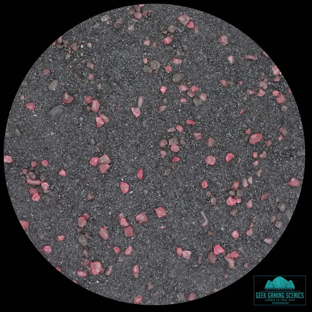 dark sand like basing material with small fuchsia crystals. Geek Gaming Scenics Base Ready Grimdark Tomb World Fuchsia