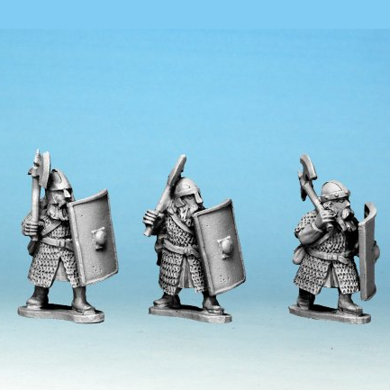 Three metal figurines of warriors with shields and spears on a blue background