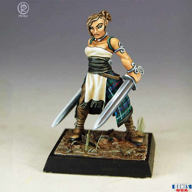 Female Barbarian (30219). A fierce Bones USA miniature featuring a warrior with twin swords, intricate armour, and a commanding stance. Multipart, unpainted