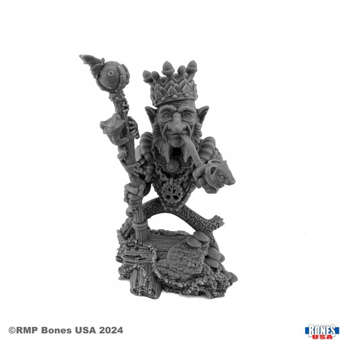Unpainted miniature of Wenzelbaum the Gnome King by Jason Wiebe. Features a crown, staff, long beard, and a detailed base with hats, rocks, and planks