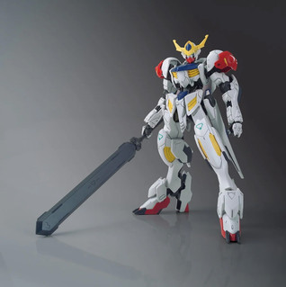 A white Gundam action figure holding a large grey sword, posed against a dark Gray gradient studio background. Gundam Barbatos Lupus - Iron Blooded Orphans HG 1/144 Gunpla Bandai