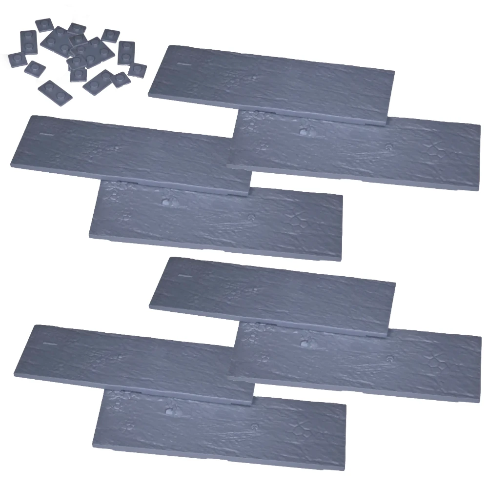 Kings of War Modular Plastic Base Set 120x40mm. Set of slate coloured plastic tiles on a white background