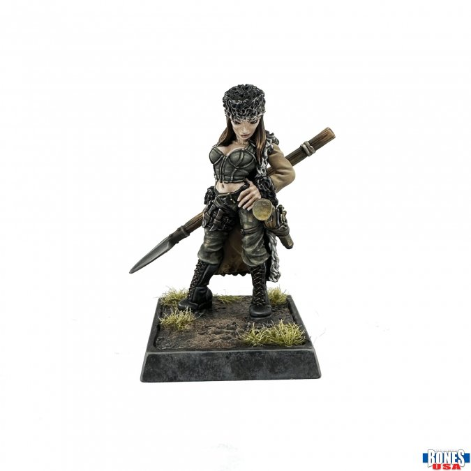 Unpainted Mercenary Huntress miniature by Werner Klocke from Bones USA. Features a spear, armour, and square base with terrain textures. Printed in RMPrint material.
