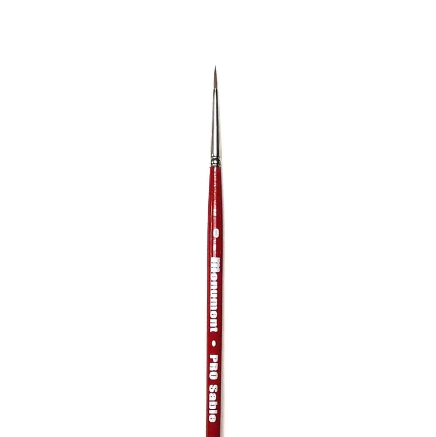 A single fine detail paintbrush with a red handle and silver metal ferrule, featuring white text that reads on a plain white background. Monument Hobbies PRO Sable Paint Brush Round 0