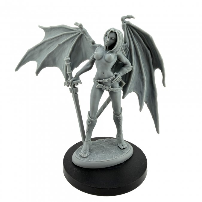 A gray unpainted fantasy miniature figurine of a winged female warrior holding a sword, mounted on a round black base against a white background.