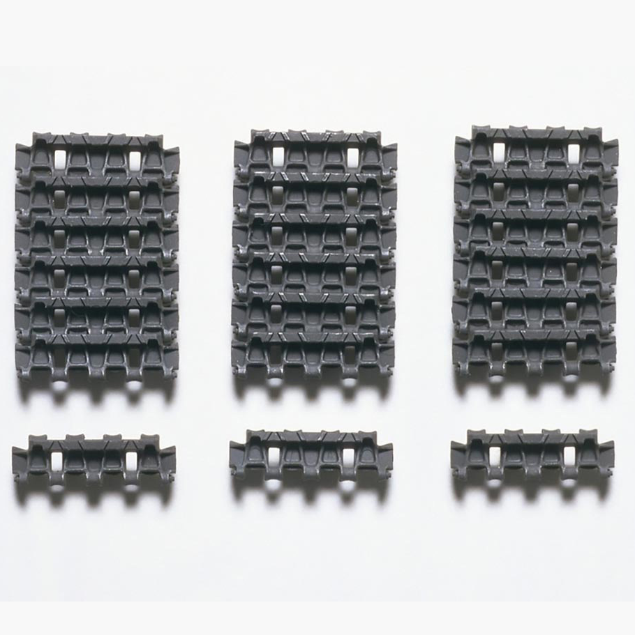 Tamiya German Panther Type G Separate Track Links. Set of six black plastic tracks on a white background