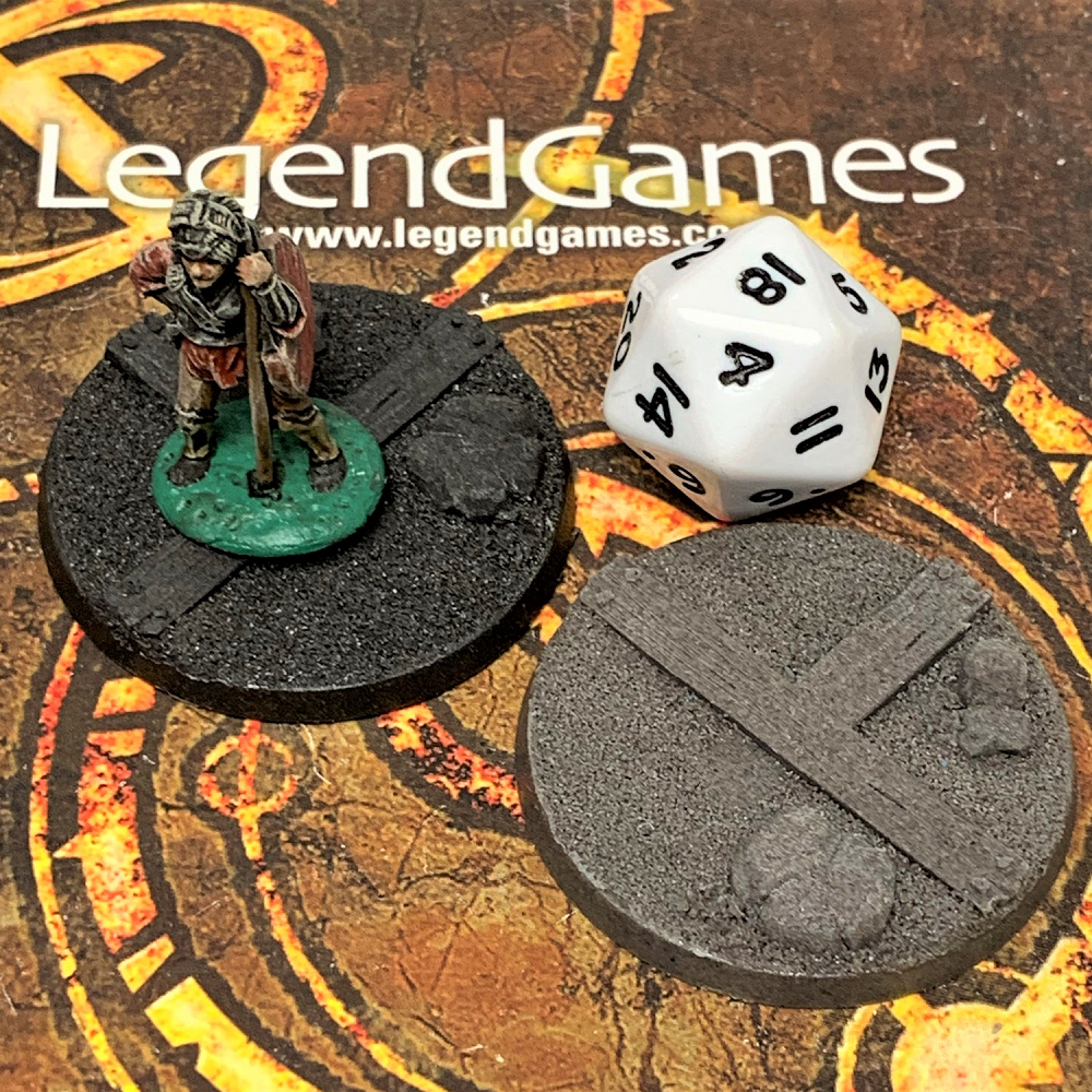 A set of two pirate themed bases by Legend Games. 40mm bases with textured surface like sand and wooden planks for your gaming miniatures.
