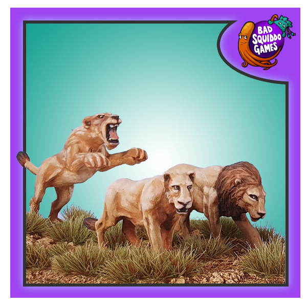 Lions from Bad Squido Games. Metal gaming miniatures. female and a male with all four paws on the ground and a female raised up as if pouncing with only her two back paws on the ground.