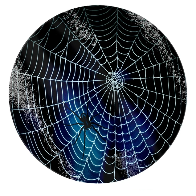 A toughened glass chopping board with a midnight background and spiderweb and spider design.