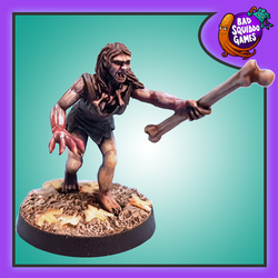 The Ghoul Queen by Bad Squiddo Games is a metal miniature depicting a female ghoul holding a large bone