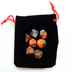 Black Rectangular Dice Bag With Red Drawstring and orange and black dice on top 