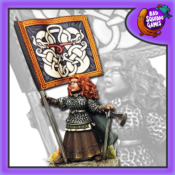 holding an axe and a spear (which a flag could be attached to) dressed in chain mail with her hair down