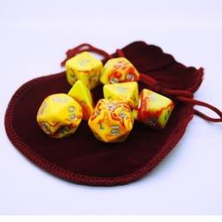Small Dice Bag in Burgundy with yellow and red dice on top 