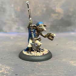 Sea Sick Stu from the Moonstone mushroom and mayhem troupe box,  pre painted by Mrs MLG. This wonderfully sculpted miniature holds a mug over spilling with frothing grog and we are fairly certain that harpoon is holding him up. This delicate miniature is painted with greens, blues and browns. 