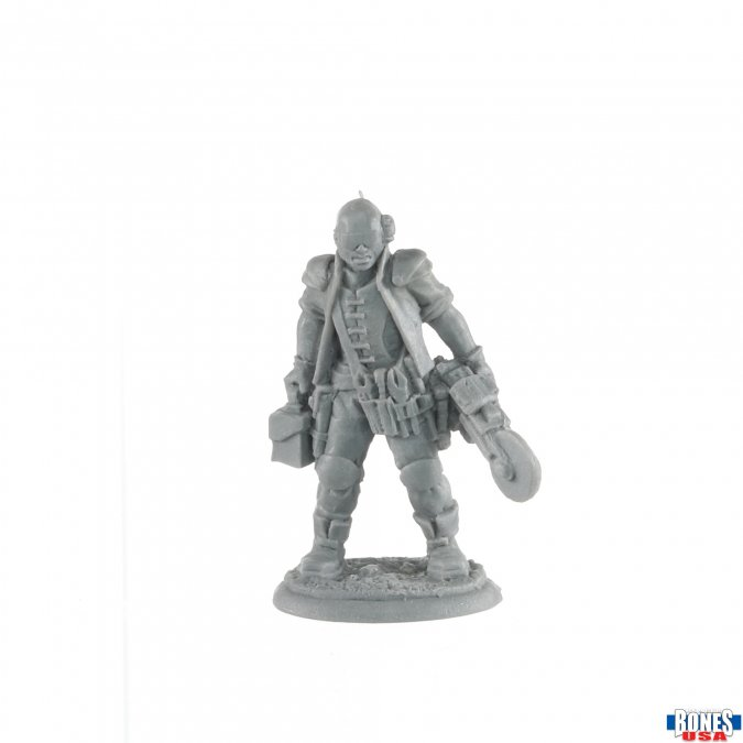 Chit Jubal, Arkos Chopper from the Bones USA range by Reaper Miniatures. A great male Sci-Fi character for your gaming table and RPG setting holding a circular saw in one hand and a tool box in the other wearing eye googles and having tools on his belt.
