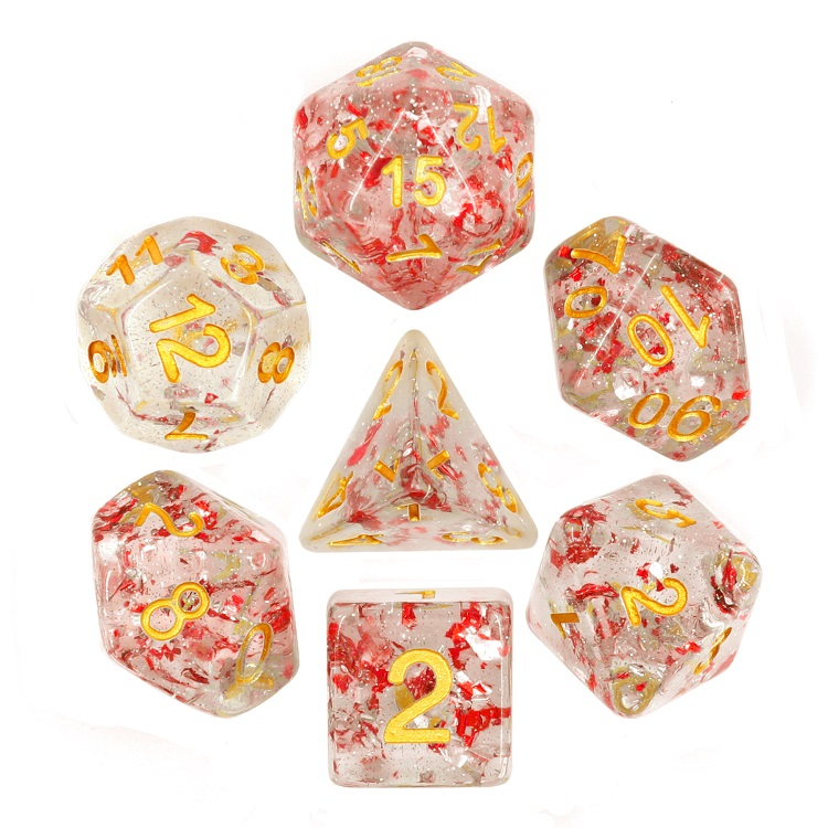 set of gold numbered dice with red and silver glitter flakes inside