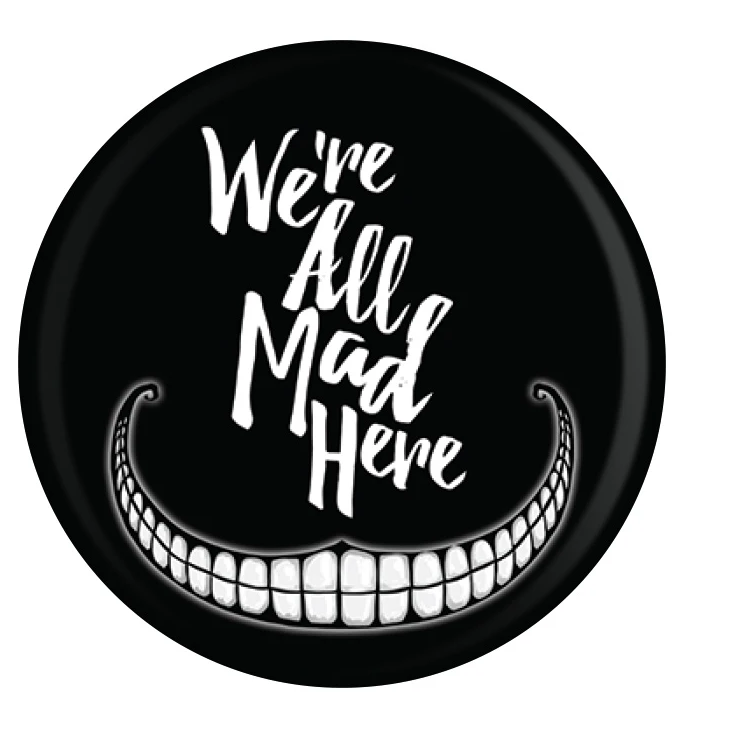 A black badge with We're All Mad Here in white writing and a stylised Cheshire cat grin underneath
