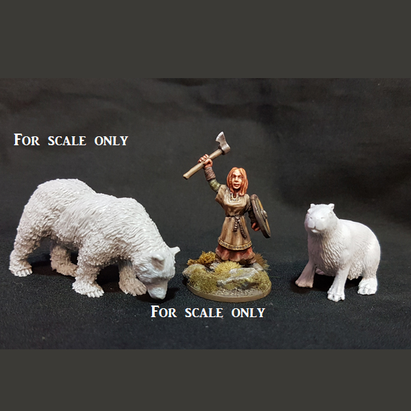 an unpainted bear, a painted human figure holding an axe above her head and an unpainted miniature of a capybara for scale reference