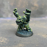 Boulderkin from the Reaper Miniatures range pre painted by Mrs MLG. This cute but angry little rock monster is painted with a limited pallet of yellow, green and black