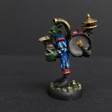 Hand painted one man band from the Reaper Miniatures range. Mrs MLG has painted this wonderful little goblin playing all his instruments for the one man band using a blue and red colour scheme for his clothing. 