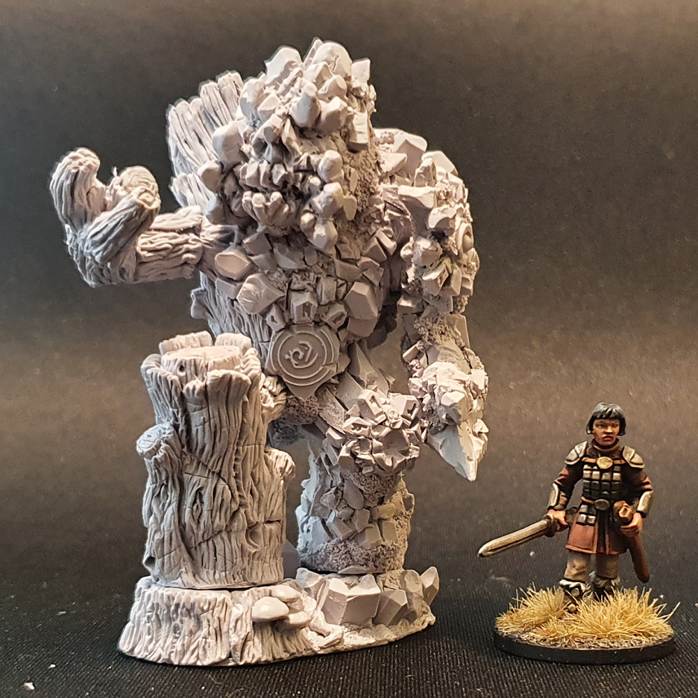 Nature Elemental by Bad Squiddo Games is sculpted by Ristul and would make a great elemental for your gaming table. Approximately 76mm from the toe to the top of its head and comes in four pieces. An earth elemental in a tree style made from resin. Shown with a human miniature next to it