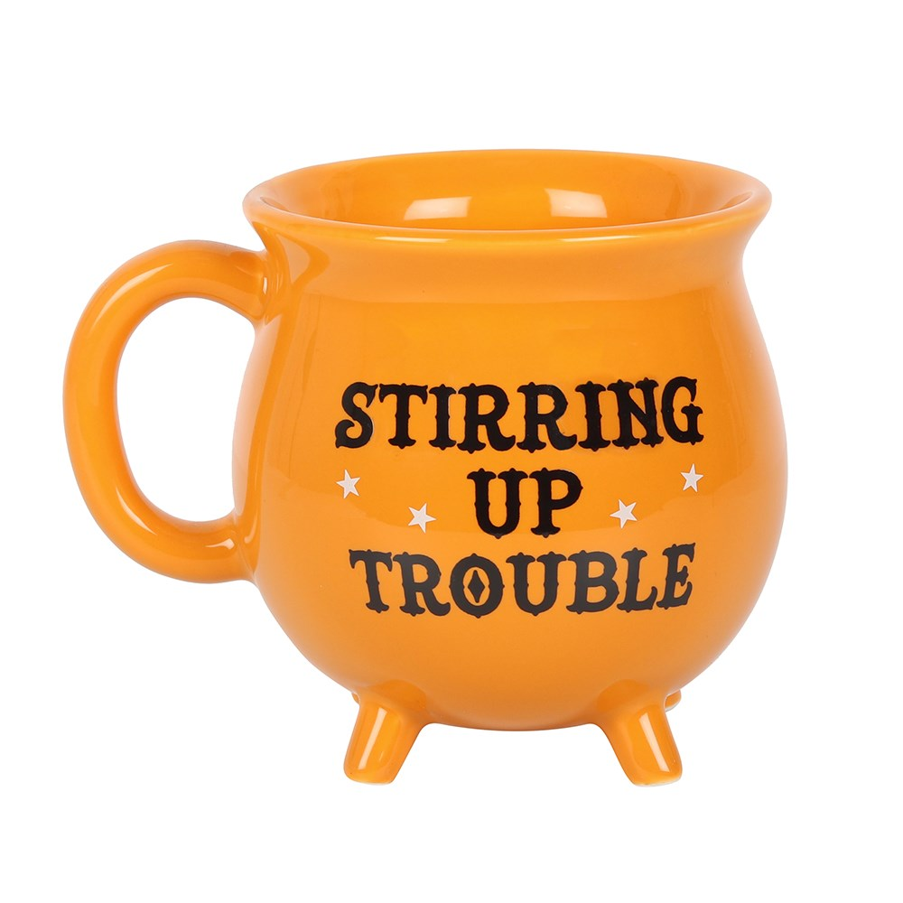 Cauldon mug in orange with the words 'Stirring Up Trouble' in black and white star detail.