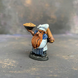 Tub the Dwarf Baker from the Reaper Miniatures Bones USA range pre painted by Mrs MLG.  This slightly grumpy looking baker has his wonderfully scrumptious pie in one hand and a rolling pin over his shoulder in the other, painted with blues and whites and sporting an elegant ginger beard. #