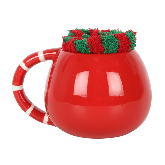 A rounded mug with Santa face d...