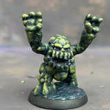 Boulderkin from the Reaper Miniatures range pre painted by Mrs MLG. This cute but angry little rock monster is painted with a limited pallet of yellow, green and black