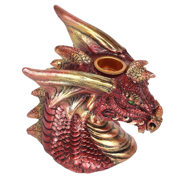 A red and gold dragon head with green eyes incense burner