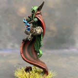 Raegan Priestess from the Monnstone malachite mystics troupe box pre painted by Mrs MLG. This Leshavult priestess miniature is painted with reds, browns, blue and greens.