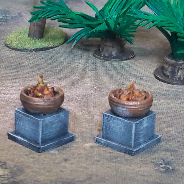 Aztec Braziers (Irongate IG00075) :www.mightylancergames.co.uk A set of two Aztec Braziers by Iron Gate Scenery in 28mm scale produced in PLA representing lit brazier lighting enabling you to add detail and decoration to your dungeons, tabletop games, RPGs and hobby dioramas.