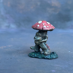 A Reaper Miniatures Mushroom Man hand painted by Mrs MLG. Painted with brown and reds and having yellow eyes this is a cute little fella is in a walking stance and looks as though his is whistling as he walks along.