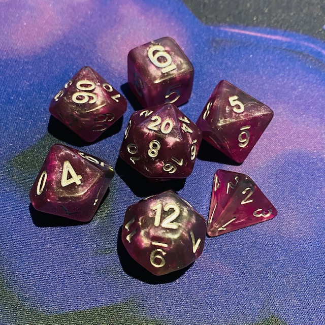 Shimmering clouds of rich purple with a hint of forest green and silver numbers make these Storm Gem Wizards Hat dice