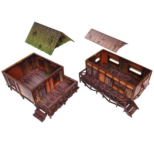 Two wooden model cabins with tha...