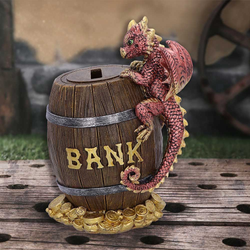 Dragon Heist Money Box by Nemesis Now. A cute little red and gold dragon clinging to the side of a barrel that has the word Bank in gold on the side.