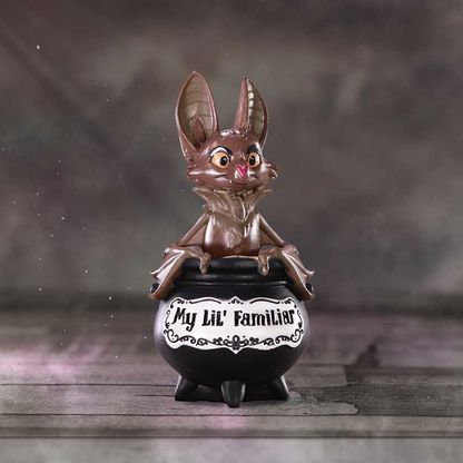 My Lil Familiar Vesper bat figurine.  An adorable ornament of a smiling bat appearing from a black cauldron with the phrase My Lil' Familiar to symbolise you conjuring this cutie from the cauldron to be your familiar pet