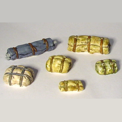 Small Stowage by Crooked Dice, a pack of six resin miniatures representing wrapped bundles for you to add to your vehicle which are great for scratch building , your town scenery, hobby dioramas and other tabletop gaming needs.