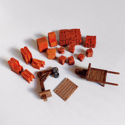 A pack of Brick Accessories by Iron Gate Scenery printed in resin to a 28mm scale. With seven different tiles, eight different bricks, one wheel barrow and one pulley system to help you dress your town scenery , tabletop games, RPGs and more.&nbsp;