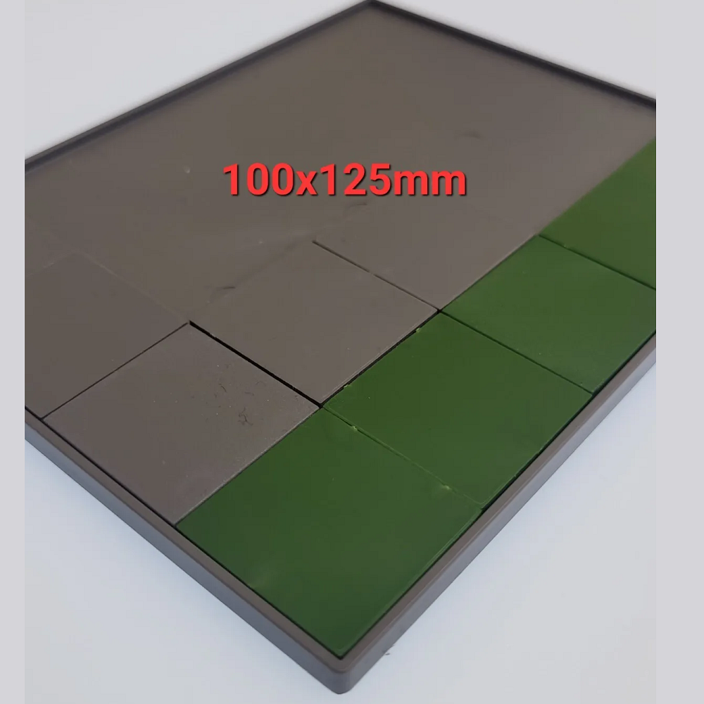 A pack of 2 movement trays measuring 100mm x 125mm from Tabletop Workshop, designed to fit twenty 25mm square bases in a 5x4 formation for tabletop gaming.